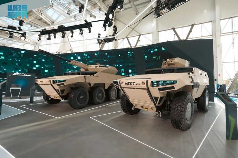 مدرعات "هيت" (وكالة الأنباء السعودية) Riyadh, February 11, 2026, SPA -- SAMI Land Company, a subsidiary of Saudi Arabian Military Industries (SAMI), a PIF company, unveiled the HEET Program, introducing a new generation of advanced wheeled armored vehicles during the third edition of World Defense Show 2026. Developed with full Saudi intellectual property and indigenous design, the program will be entirely manufactured within the Kingdom by Saudi talent, representing a significant step forward in strengthening operational readiness and advancing national defense industrial capabilities. The HEET Program will be produced at the SAMI Land Industrial Complex, the largest fully integrated facility of its kind in the Middle East and North Africa. Spanning 82,000 square meters within a 1 million-square-meter industrial zone, the complex operates in line with Industry 4.0 standards, leveraging artificial intelligence, the Internet of Things, and advanced robotics to enhance efficiency, precision, and production quality, in accordance with the highest international standards. Serving as a strategic foundation for the Kingdom’s land-systems manufacturing base, the complex functions as a national hub for local production, technology transfer, and workforce development. It will create more than 1,000 high-quality jobs for Saudis and operate as a center of excellence for the manufacture, testing, and lifecycle support of wheeled and tracked armored vehicles and turrets, with an annual production capacity of up to 1,500 military vehicles. This reinforces supply chain resilience and strengthens defense industrial readiness at scale. The launch of the HEET Program represents a strategic milestone in advancing defense localization, operational independence, and the development of national military-industrial capabilities. It reflects the Kingdom’s transition toward deeper engineering ownership, advanced systems integration, and sovereign manufacturing in the land domain. The program has been developed by Saudi engineers and specialists within an advanced industrial environment that reflects the maturity of national capabilities and readiness to deliver long-term, strategically significant defense programs. The HEET portfolio includes 4×4, 6×6, and 8×8 advanced wheeled armored vehicles engineered specifically for ground operations and designed to support border protection, reconnaissance, rapid response, and field operations. The vehicles offer high ballistic protection, superior mobility, modular design, advanced systems integration, and reduced lifecycle costs compared to global and internal competitors. Designed for rapid deployment across urban, desert, and off-road environments, the platforms feature integrated command-and-control systems and optional manned or unmanned systems, ensuring operational flexibility across diverse mission profiles. The program also supports integration of the ROAYA Remote Turret 12.7mm, equipped with high-accuracy day and night targeting systems while providing full crew protection. The platform is further designed to accommodate integration of a 105mm turret to deliver direct fire support capabilities based on operational requirements. SAMI Land Company CEO Eng. Mohammed Al-Hodaib said: “The launch of the HEET Program reflects a decisive step in building an integrated national defense and security industry rooted in Saudi expertise and full in-Kingdom design, development, and production. The program is engineered to support border protection, reconnaissance, rapid response, and land operations, meeting the evolving needs of our military and security forces while enhancing armed forces readiness to the highest global standards. HEET represents confidence in Saudi capabilities and a firm commitment to building sustainable sovereign capacity, strengthening local supply chains, and advancing the objectives of Vision 2030.” Through the HEET Program, SAMI continues to advance its role in shaping a resilient national defense ecosystem, accelerating localization, strengthening sovereign industrial depth, and reinforcing the Kingdom’s position as a growing regional hub for advanced defense manufacturing. -- SPA 19:25 Local Time 16:25 GMT 0068