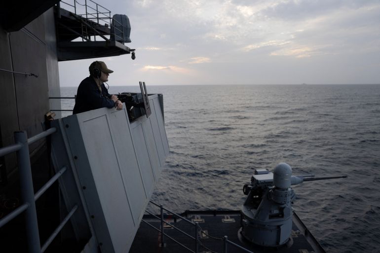 A US Navy sailor serves as a lookout aboard the USS George Washington in the Arabian Sea, September 13, 2026. The aircraft carrier, capable of carrying more than 5,000 personnel, is enforcing a US naval blockade against Iran and providing cover for commercial vessels transiting the Strait of Hormuz. REUTERS/Ed Ou SEARCH "OU USS GEORGE WASHINGTON" FOR THIS STORY. SEARCH "WIDER IMAGE" FOR ALL STORIES.